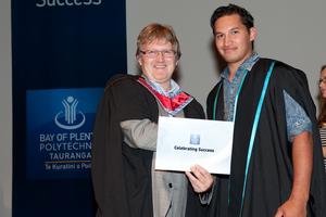 Dave Bishop (L) congratulates music graduate Sam Walker.